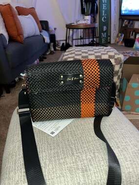 Maria by Herrera Woven Crossbody Bag Black and Orange Stripe